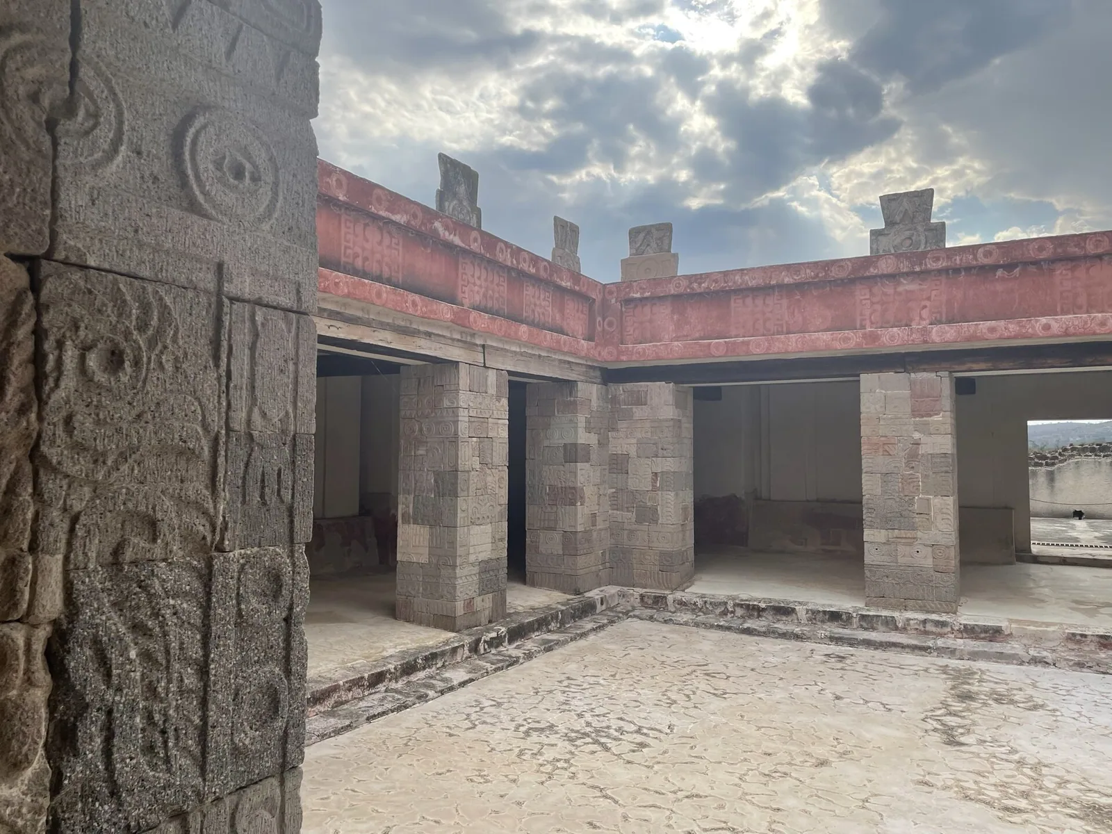 Carved column detail at the Palace of Quetzalpapalotl, Teotihuacan. It is into sockets like these that obsidian was set for the eyes Ott and Wasson read as visionary sight — perception distributed across the architecture, looking back at the room’s occupants.