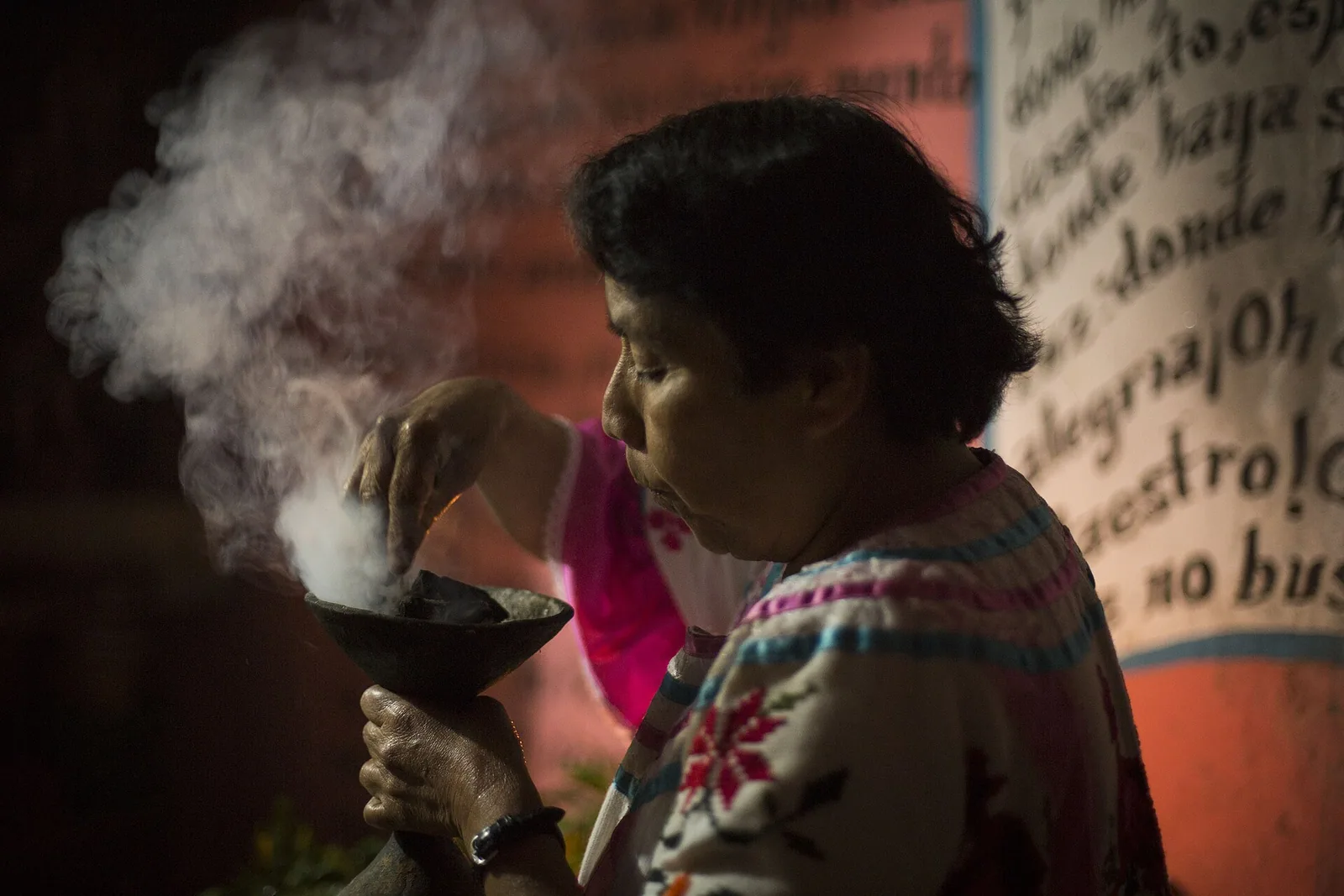Copal smoke. Chatino testimony from Santa Lucía Teotepec describes copal and nocturnal questioning; Ravicz’s Mixtec account describes a metate, a night, and a companion who listens. The apparatus is modest and the same few things recur across the region.